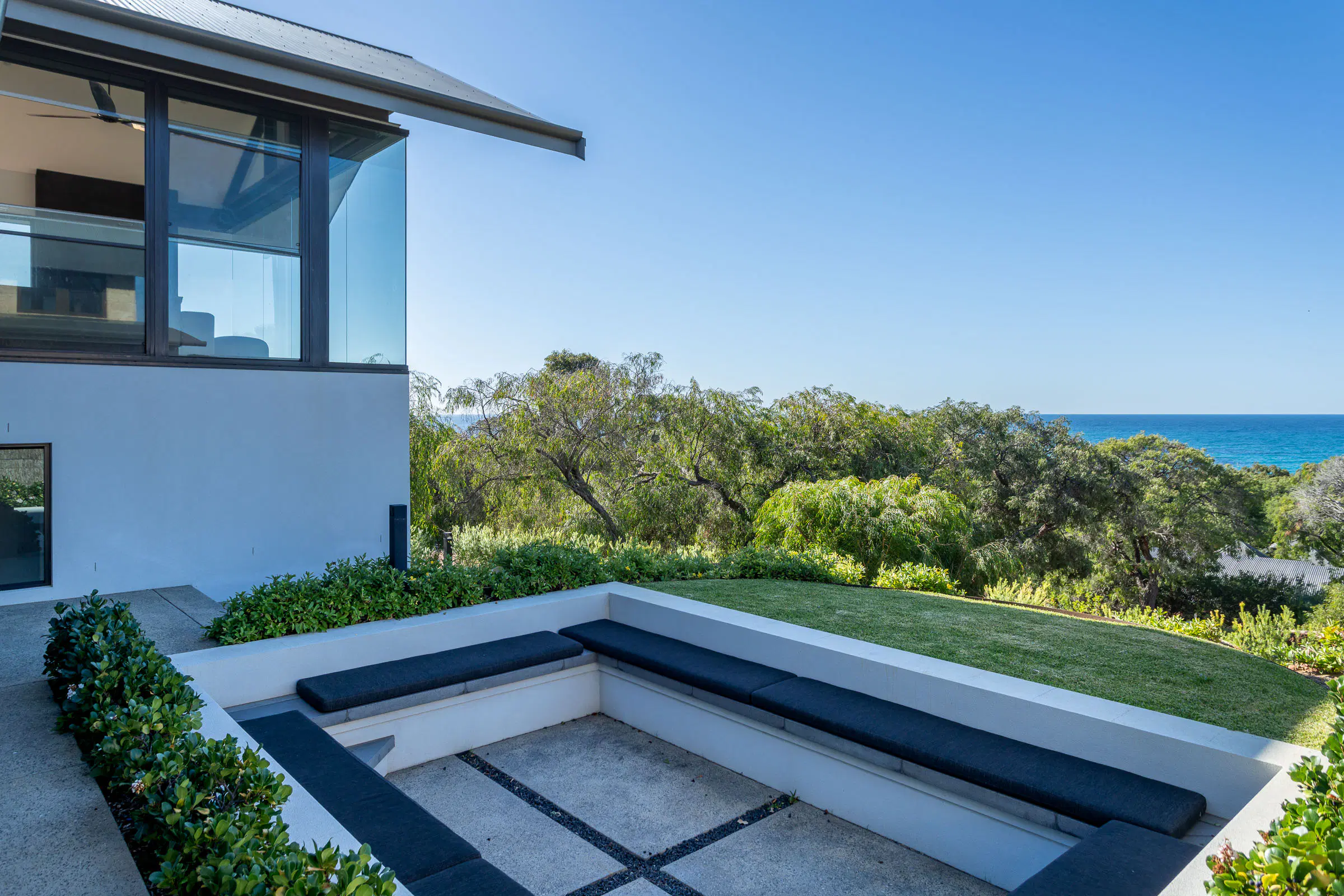 Outdoor seating, looking over the scrub to the sea